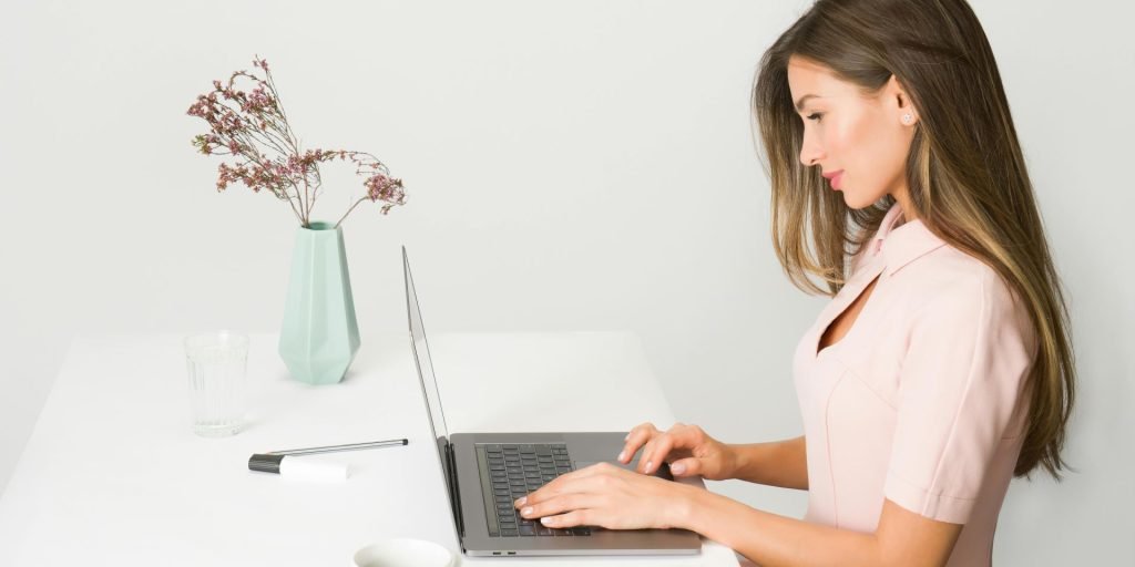 woman doing SEO on her laptop